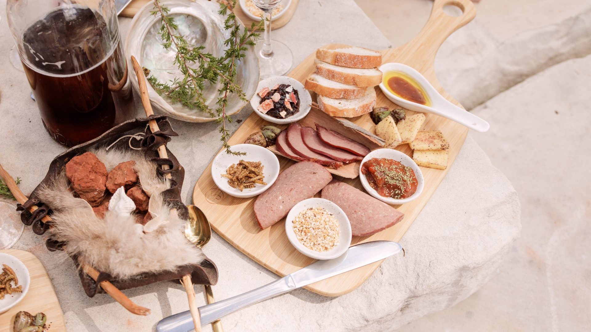 Chef Braydon Gower (pictured) prepares a platter of traditional ingredients and dishes, from finger lime jam to wallaby salami.