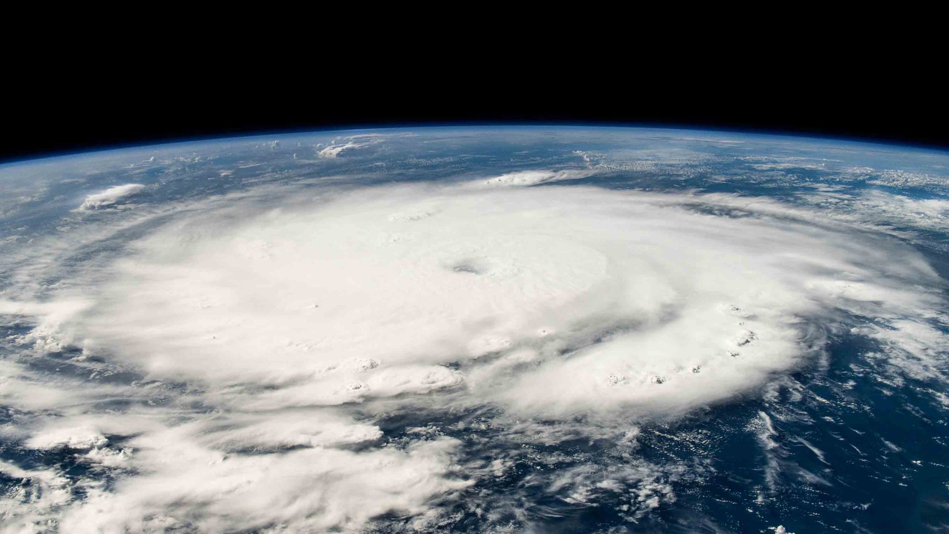 Imagery of a hurricane seen above earth.