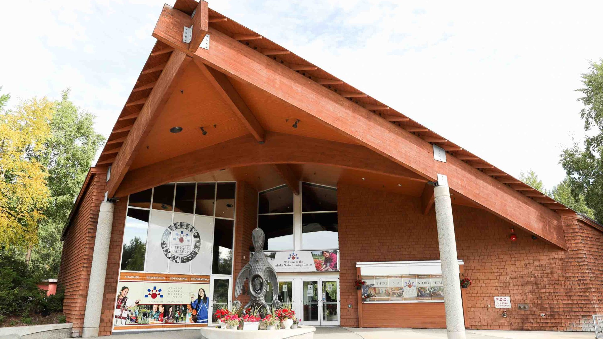 A wooden building with a sloped roof.