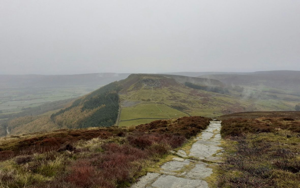 Slightly misty view over moorlands that extend into the distance