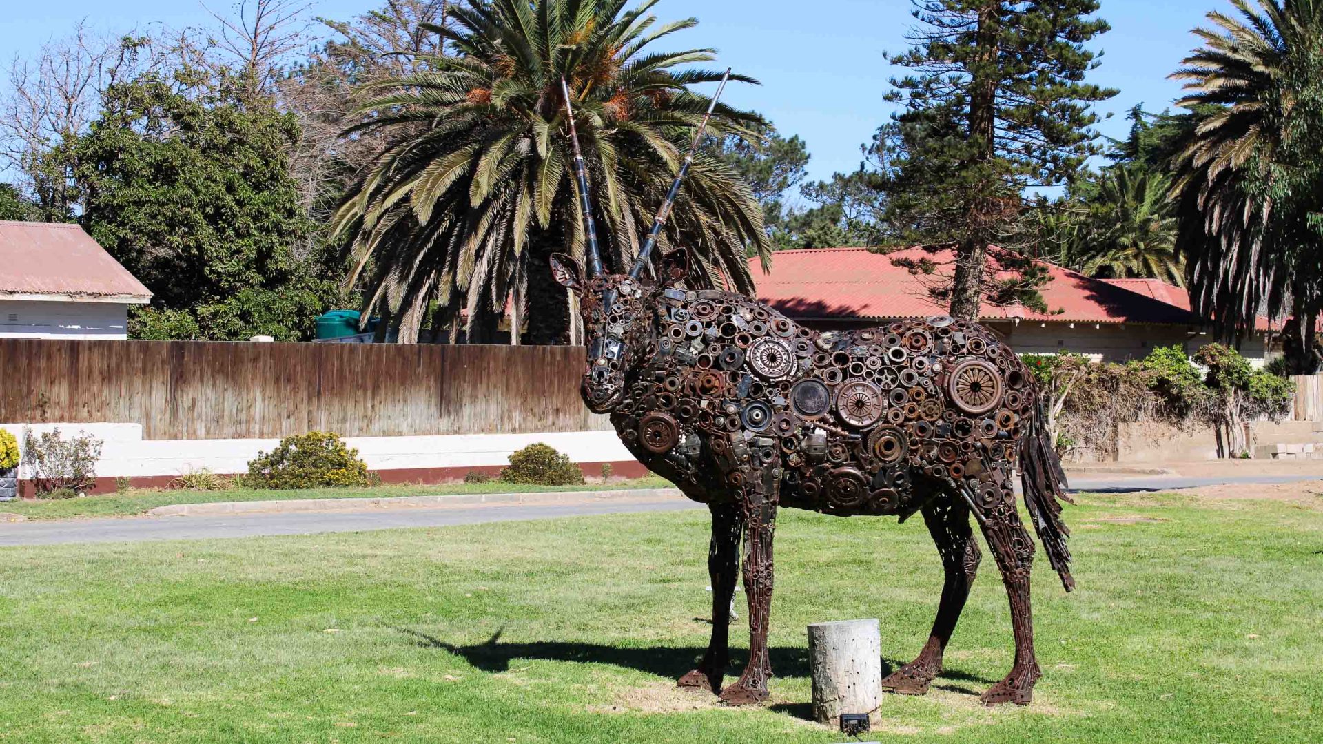 A sculpture of an oryk made from machine parts.