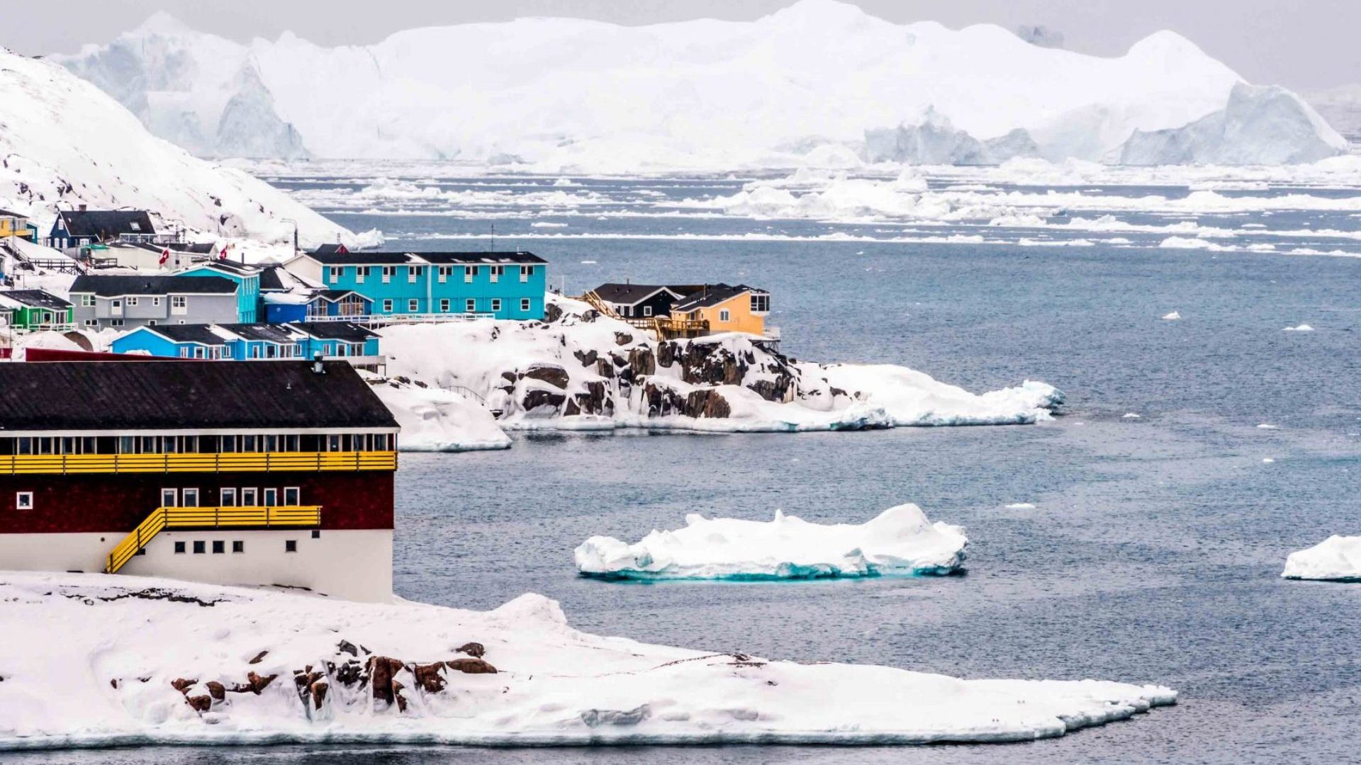 Colourful houses at frozen water's edge