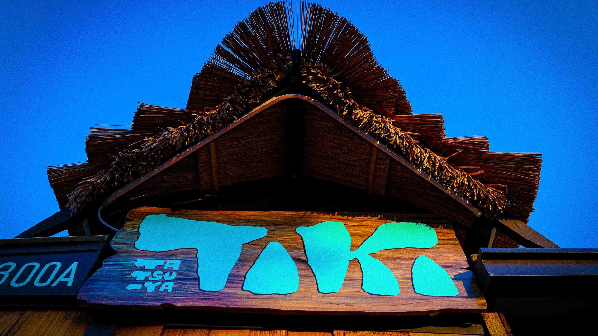 The word 'Tiki' is written in blue on an ornate building.